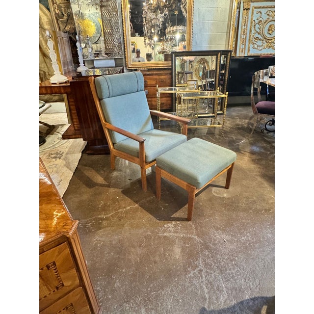 The Danish MCM Oak Chair and Ottoman is a stylish and comfortable furniture set. Made from high-quality oak, this set...