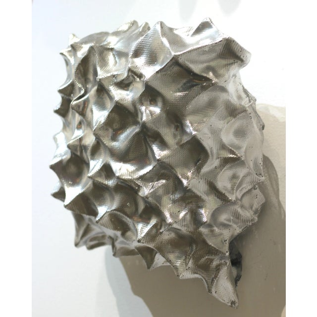 Atticus Adams' organically composed modern metal sculptures embody the transformative power of art, illustrating the...