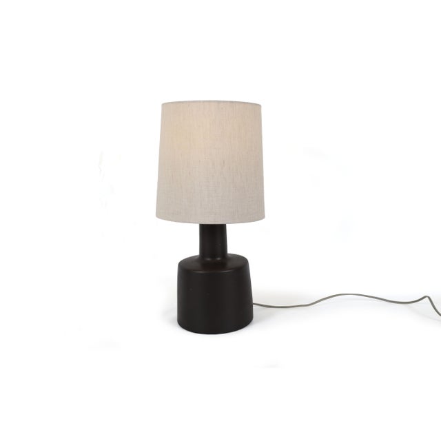 This Jane and Gordon Martz table lamp exemplifies the refined craftsmanship and minimalist design associated with the...