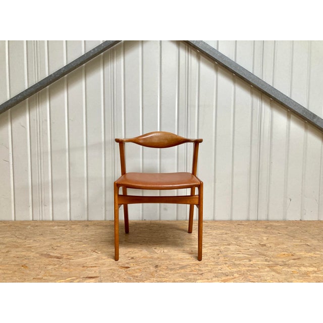 Mid-century modern armchair in teak, designed by Erik Kirkegaard for Høng Stolefabrik, Denmark, model 49. Curved backrest...