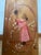 A beautiful vintage wooden quilt rack with hand-painted accents of a woman picking flowers. In addition to hanging linens,...