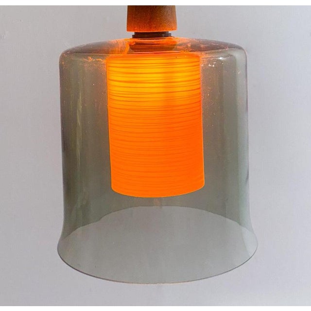 Scandinavian Pendant, Glass and Teak, 1960s - 4 available Up to 250V (Europe/UK Standard).The wiring of this item may be...