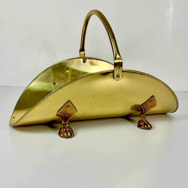 A traditional Federal style brass Firewood Holder. It has the Americana Arts & crafts curled basket shape with an arched...