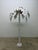 Single fabric coconut palm tree. The palm leaves are adjustable. Unsigned but most likely by Jeff and Lisa Wright, 1990s.