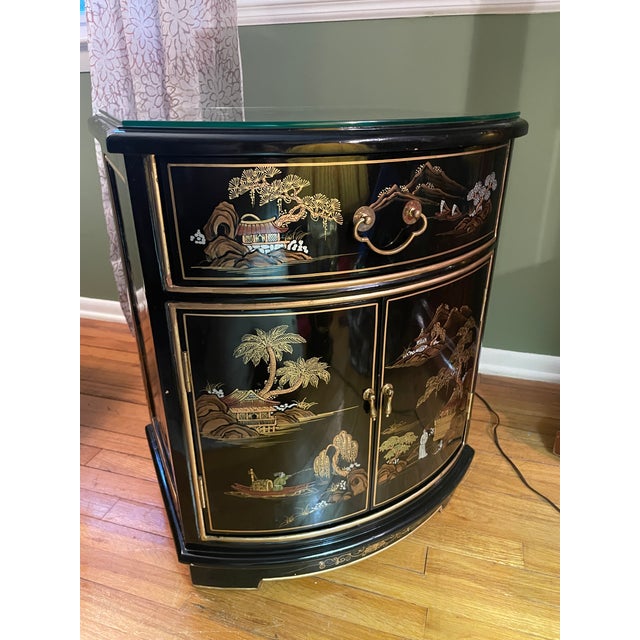 An exceptional, highly collectible vintage mid-century modern Chinoiserie demilune accent cabinet (maker unknown). This...