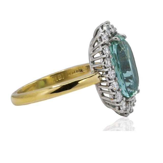 Platinum & 18k Ring with GIA certified 4.96 carat bluish green tourmaline and 18 round brilliant diamonds weighing...