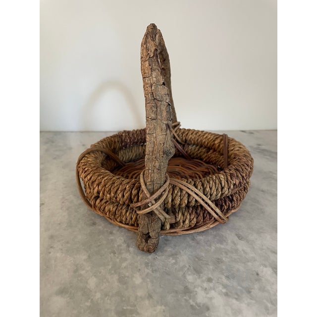 Vintage Artisan Made Rustic Woven Basket With Live Branch Handle and Twig Details.