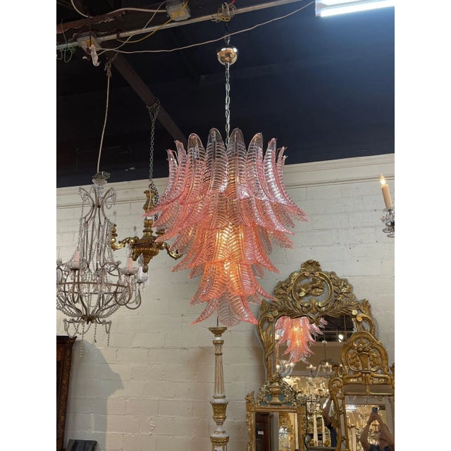 Beautiful modern pink Murano chandelier. Lovely layers of palm leaf shaped glass. This glistening beauty is a super...