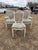 A set of six 19th century Louis XVI-style dining chairs featuring classic square backs, fluted tapered legs, and carved...