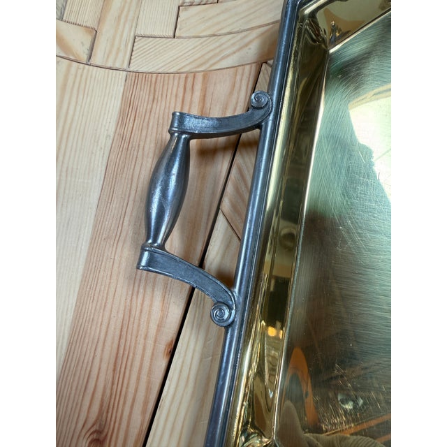 Elegant Italian serving tray featuring an octagonal brass surface framed in contrasting pewter-tone metal. The raised...