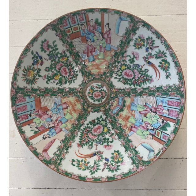 A beautiful 19th century Rose Medallion charger, the hand painted decoration in six sections, alternating scenes at court...