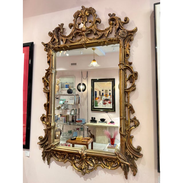 A fantastic large gold giltwood (fiberglass construction) mirror with stunning ornate detailing throughout, in a French...