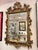 A fantastic large gold giltwood (fiberglass construction) mirror with stunning ornate detailing throughout, in a French...