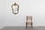 An exuberant French wall mirror from the 1950s, crafted in gilt metal and richly ornamented in the Louis XVI tradition...
