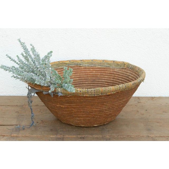 This beautifully worn nomadic harvest bowl is a prime example of rural resourcefulness. In traditional agrarian...