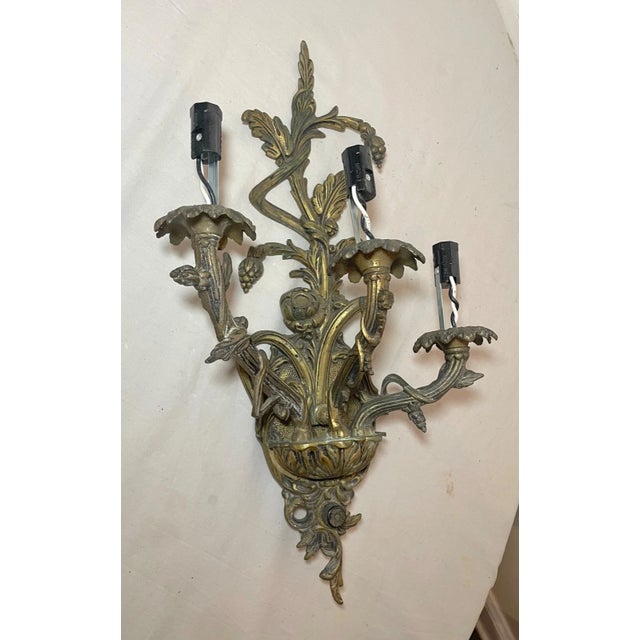 Up for sale is a wonderful antique ornate Spanish style electric wall sconce. It's elaborately cast out of solid gold...