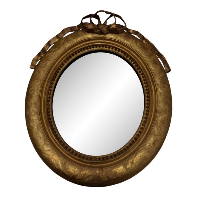 Oval Giltwood Wall Mirror With Crest, Late 19th Century. For Sale
