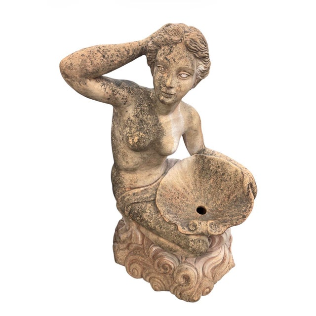 A striking mid-century terracotta garden fountain depicting a classical water nymph or maiden. This sculptural piece...