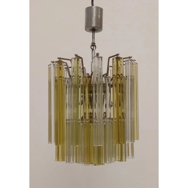 Chandelier with Murano Glass Quadrilobi pulled and worked by the magnificent Muranese craftsmen. In two alternating colors...