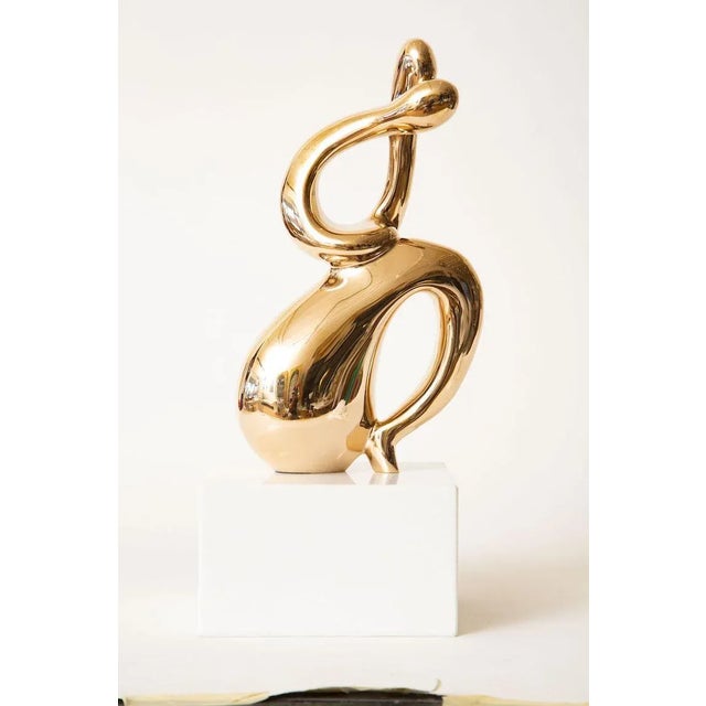 This fabulous 1960's vintage bronze abstract intertwined figurative sculpture is on a thick white marble base. It was...