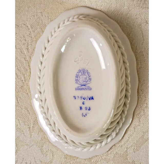 This vintage hand-painted fine porcelain miniature oval open-weave basket represents the master craftsmanship of the...