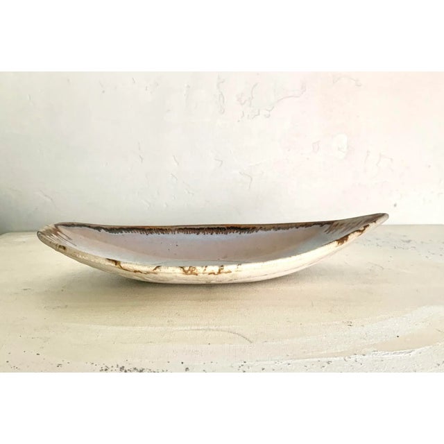 Beautiful pink and blue tone watercolor design studio ceramic small bowl Dated 1988 and artist signed on the bottom In...