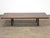 A mid century modern mahogany coffee table with brass capped feet. Professionally refinished. 60” wide. 26” deep. 13.75”...
