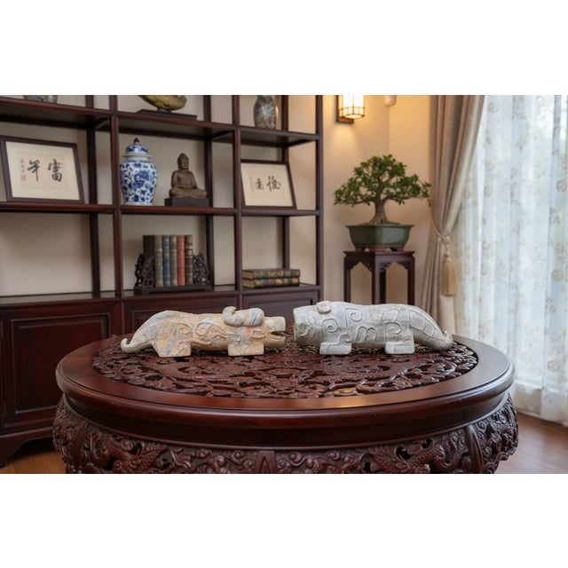 Pair of Archaic-Style Carved Stone Mythical Beast Figures Era: 20th Century Reproduction Origin: China Material: Carved...