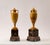 Pair of fine vases in finely worked giallo antico marble (yellow of Numidia). They rest on molded bases in polychrome...