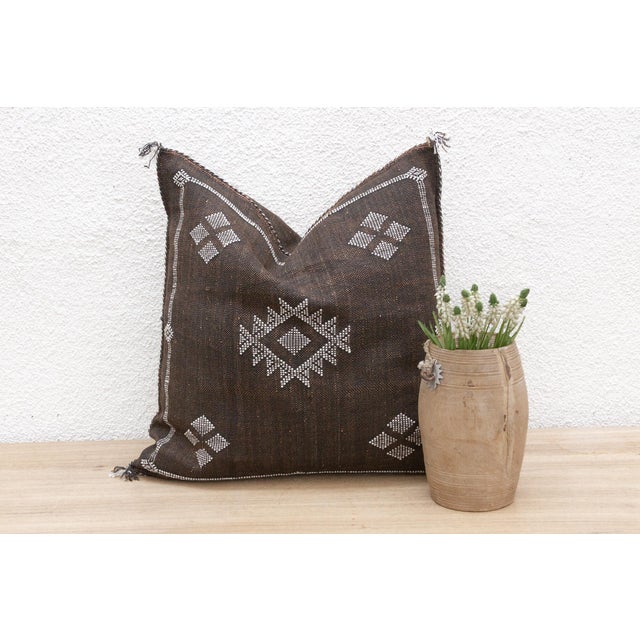 Indulge in the artistry of our handcrafted Moroccan cactus silk pillow, measuring approximately 22 inches square. Woven...
