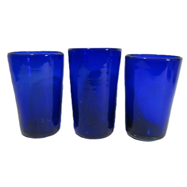 If you are a fan of blue glass, these are blown glass, deep cobalt blue, and slightly different one to the other. This is...