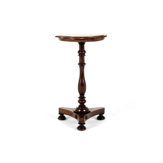 A victorian mahogany wine table or occasional table with an unusual scalloped top with a gently chamfered edge. The top is...
