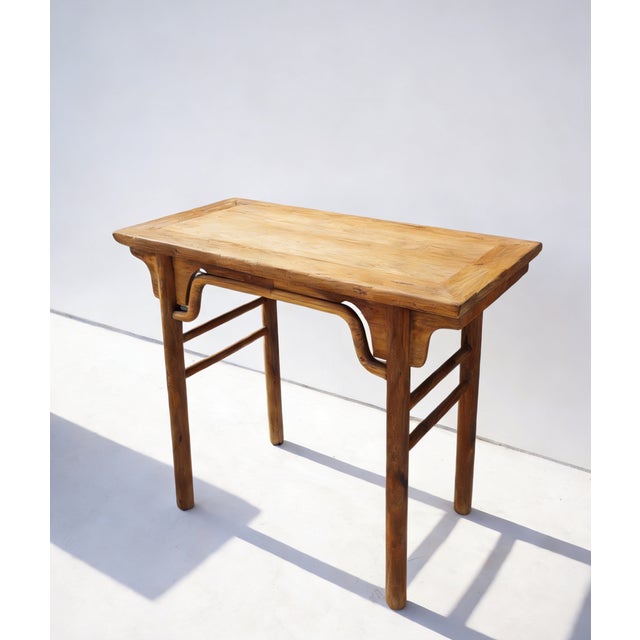 Constructed from solid elm wood, this altar table features a rectangular top with subtle everted flanges and a flush-panel...