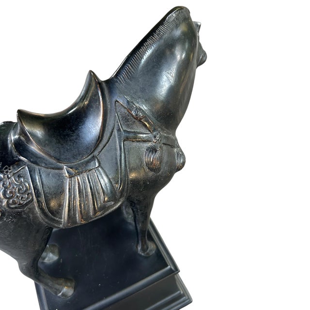 Large Chinese mid 20th Century ebonized bronze Tang Dynasty Style War Horse on stand. Well detailed