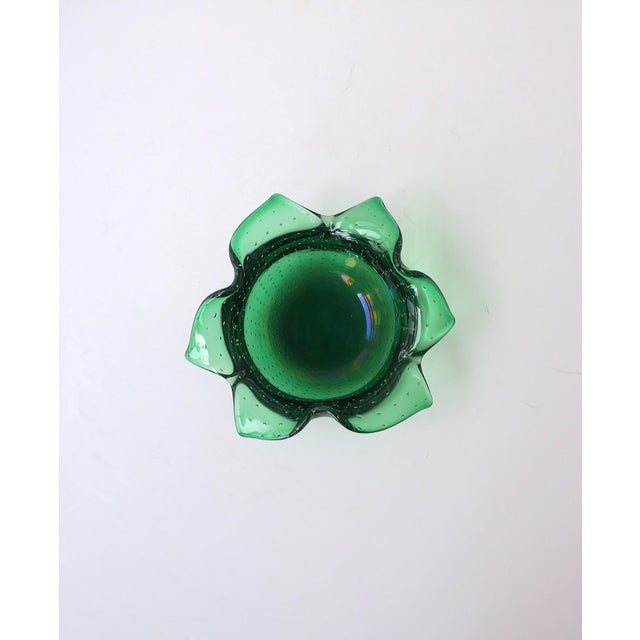 An emerald‑green art glass bowl with a controlled champagne‑bubble design, Scandinavian Modern / Organic Modern, circa...