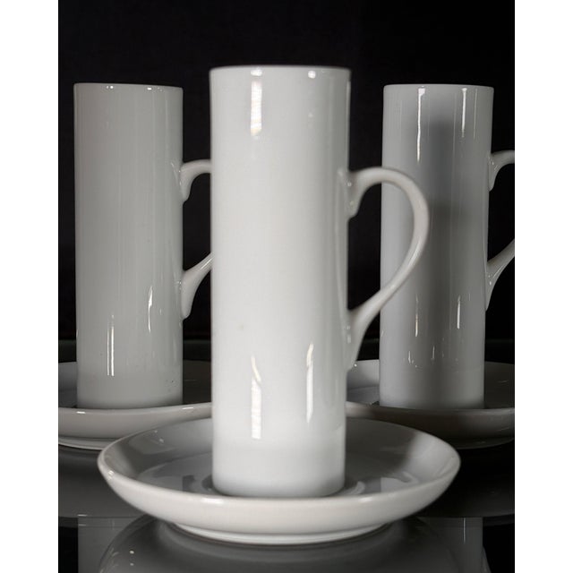 These four demitasse cups and saucers by LaGardo Tackett for Schmid are a study in modernist restraint, with the tall...