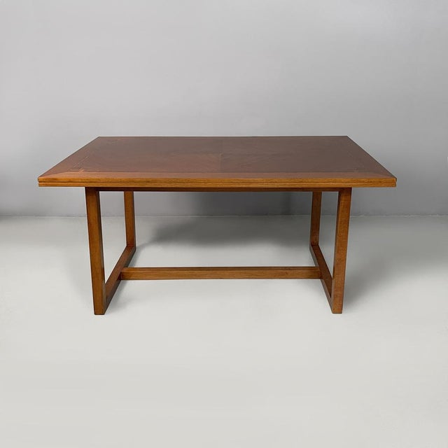 Italian Art Deco rectangular dining table in wood, 1930s Wooden dining table. The rectangular top features inlay work...