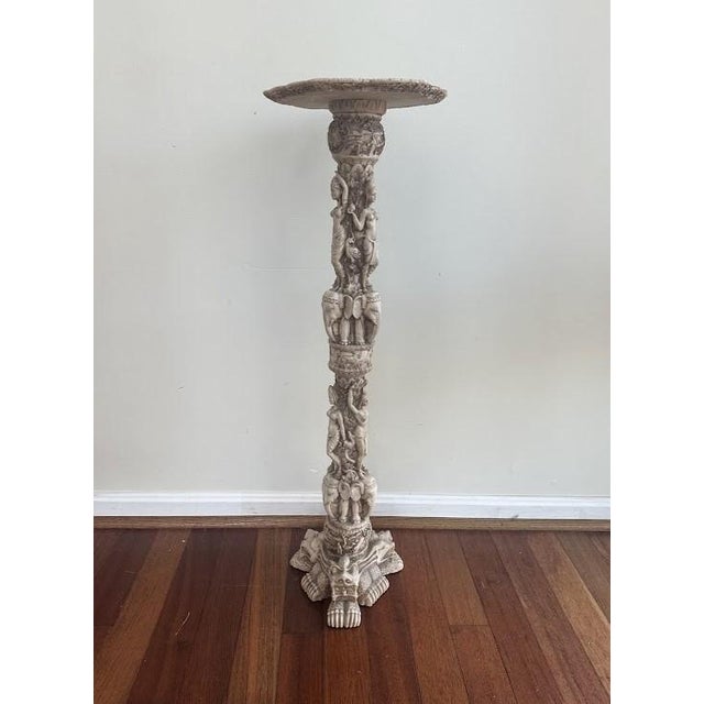 20lbs. & Repaired. Unfortunately, we are not sure of what its made of.