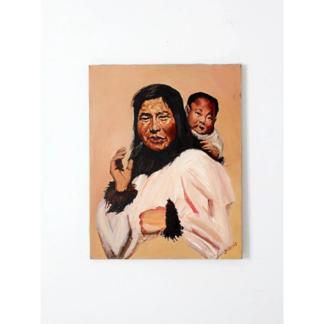 This is a vintage oil painting on canvas. Signed by the artist, the original painting pictures an Inuit mother with her...