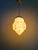 Art deco pendant light in marbled opaline glass (yellow/brown/burgundy tones) with a chromed metal frame, produced at the...