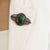 The vintage-style ornate emerald, glass-filled ruby & diamond shield brooch pendant makes a distinctive statement with its...