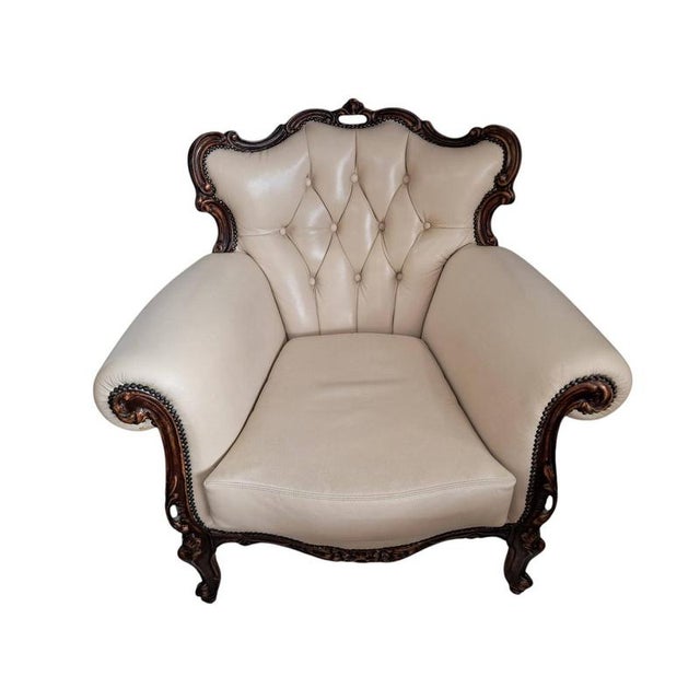 Louis xv baroque-style armchair in cream leather (1980s) a statement of opulence and refinement, this exquisite french...
