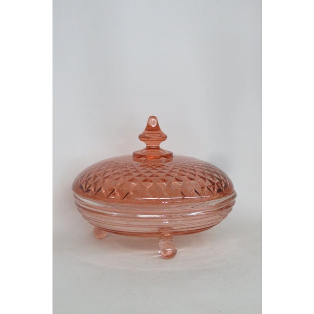 This gorgeous Lidded Candy Dish is made out of depression glass. This elegant decorative dish presents a stunning art deco...