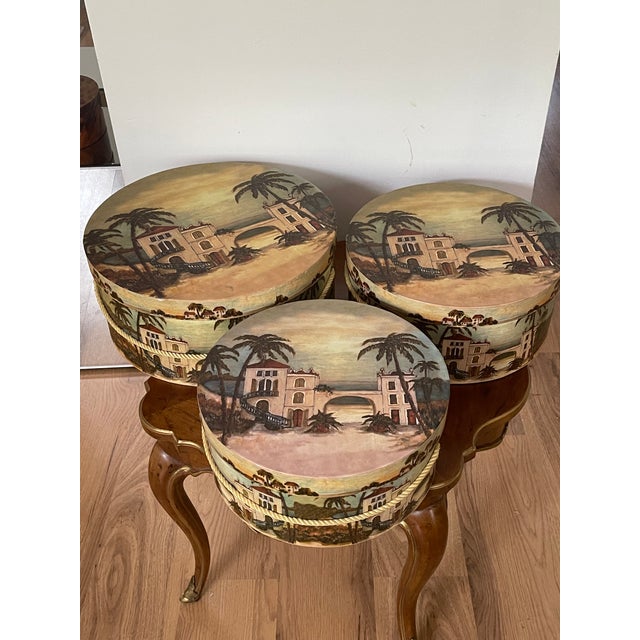 Great set of 3 collapsible hat boxes with tropical hacienda images.