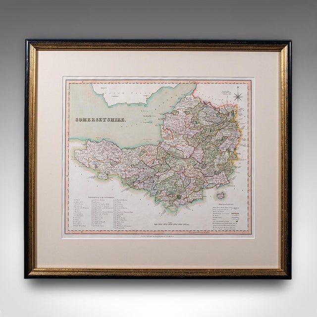 This is an antique county map of Somerset. An English, framed historical cartographic reference behind glass, dating to...