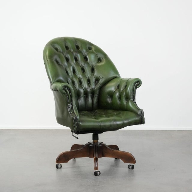 Offered by Thijs: this large and imposing green English-style cowhide Chesterfield office chair on casters with a high...