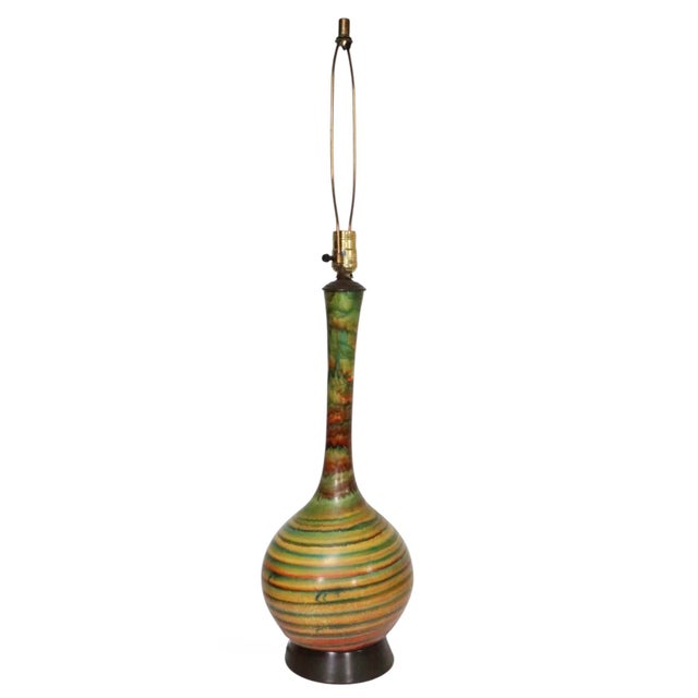 Vintage Mid Century ceramic table lamps marked Quartite 1957, with original drum shades. The lamps feature earthy green...