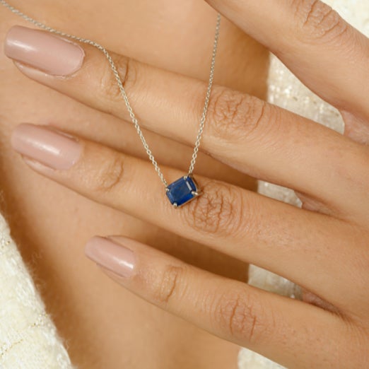 September Birthstone Blue Sapphire Solitaire Necklace in 14K White Gold studded with octagon cut blue sapphire of 1.95...