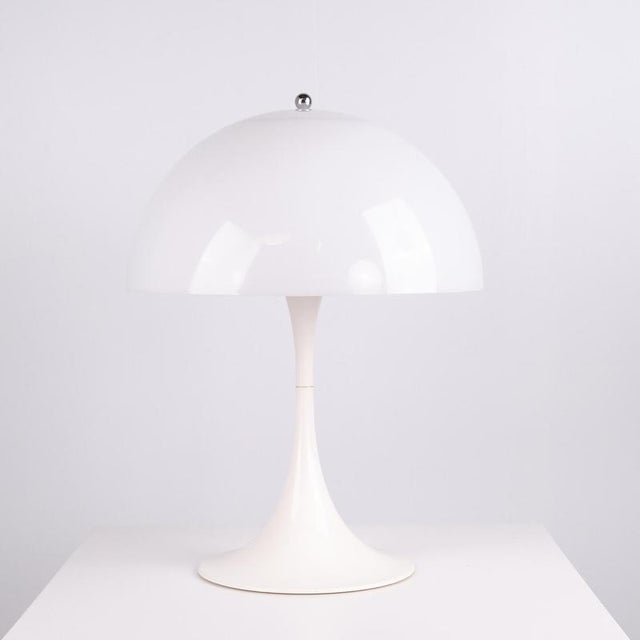 Panthella table lamp designed by Verner Panton and manufactured by Louis Poulsen in the 1970s. The lamp is made from white...