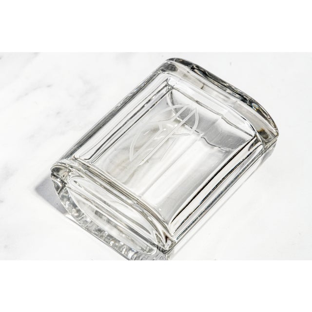 A striking example of decorative craftsmanship, this thick clear crystal trinket box combines elegant simplicity with bold...